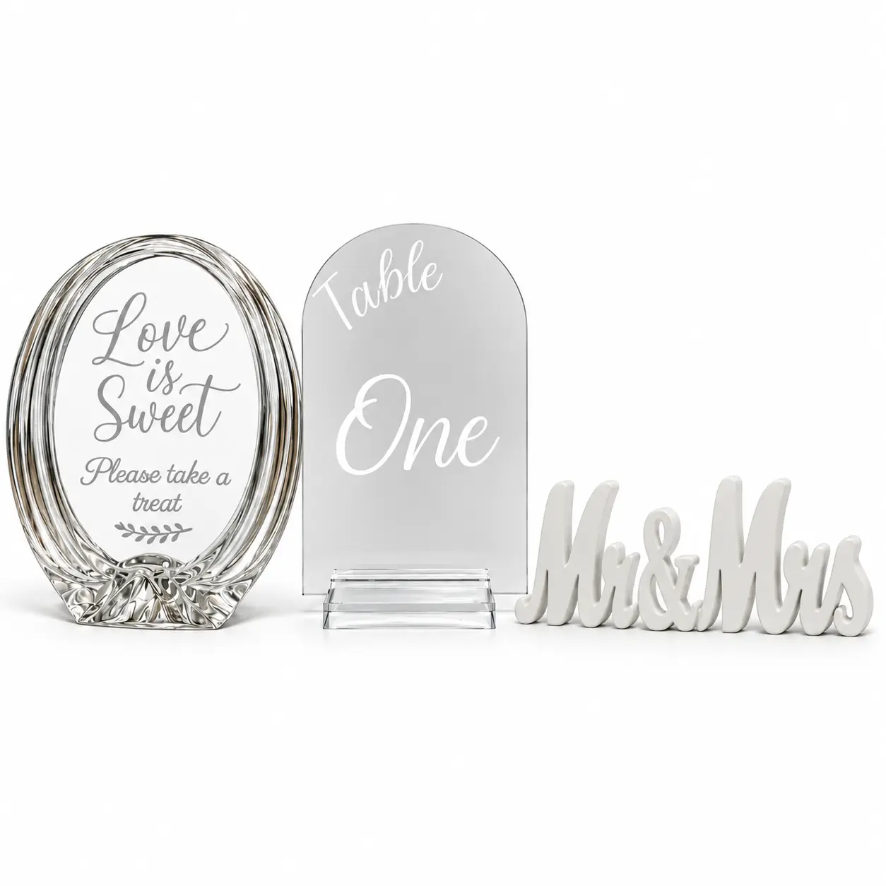 Large oval glass sign, clear acrylic table number and white Mr. and Mrs. letters together on a white background