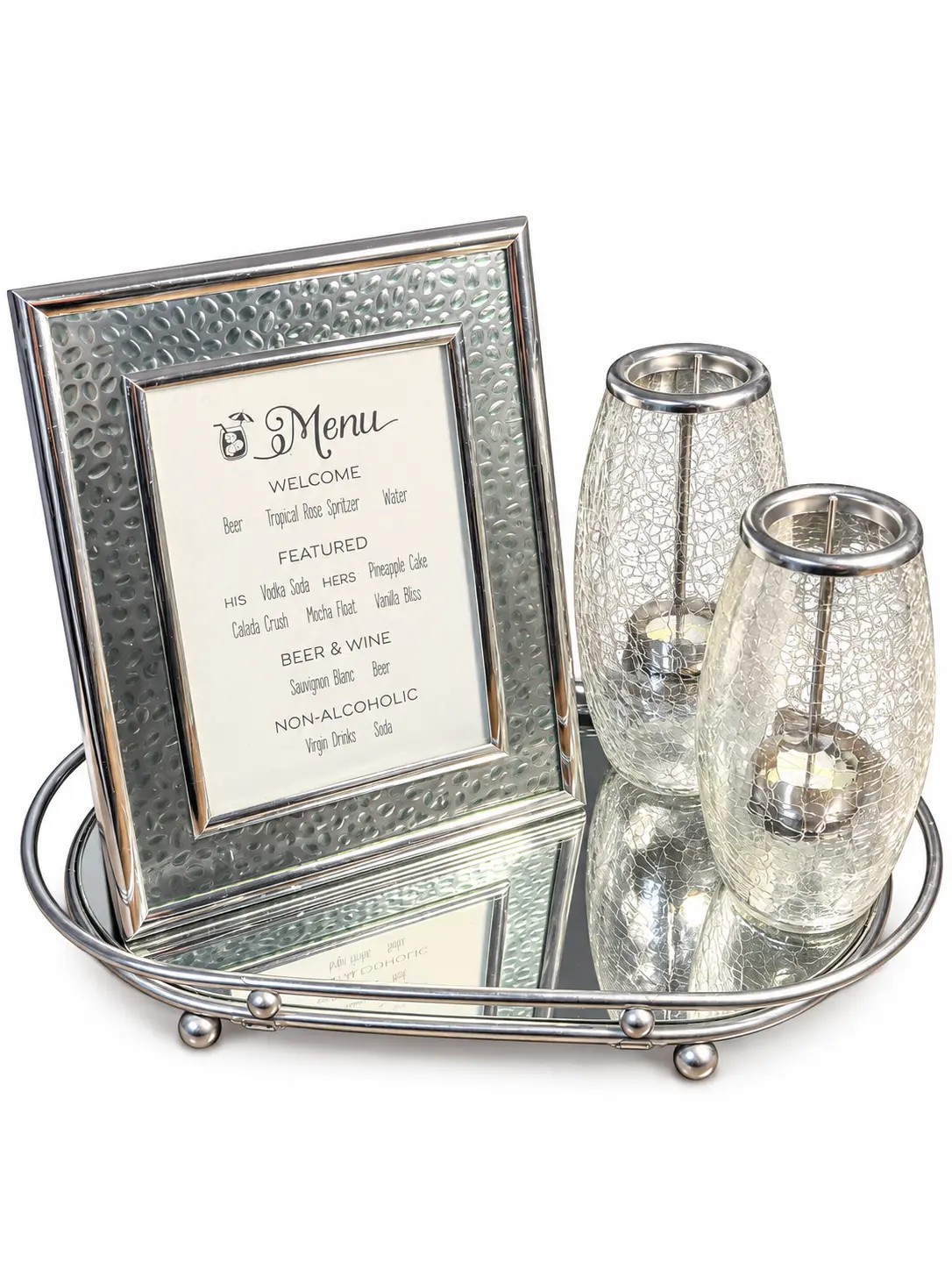Mirrored oval bar tray holding a framed drink menu and two crackle-glass candle holders