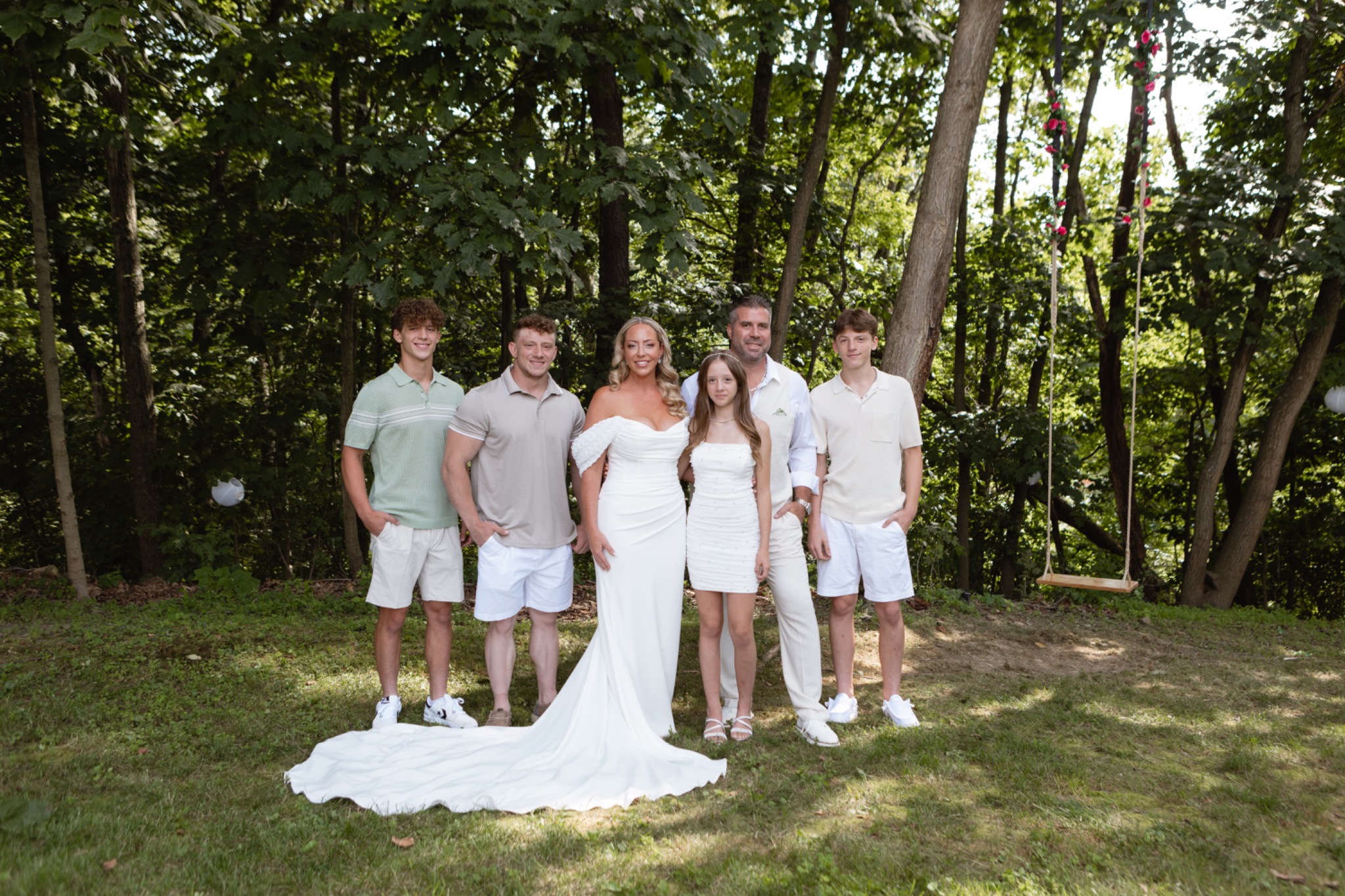Jessie and Tom with their children at their backyard wedding